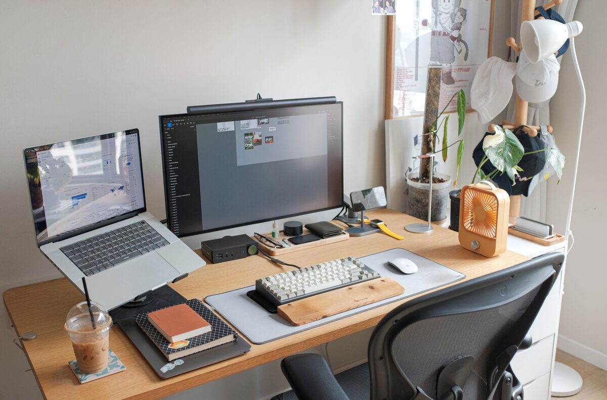 Well-organized college dorm desk setup with task lamp and minimal desk accessories