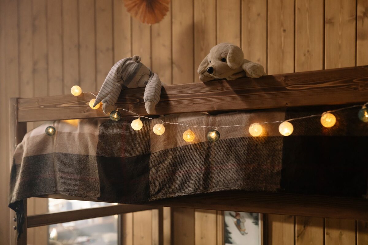Cozy dorm room with warm fairy string lights and layered ambient lighting for a comfortable atmosphere