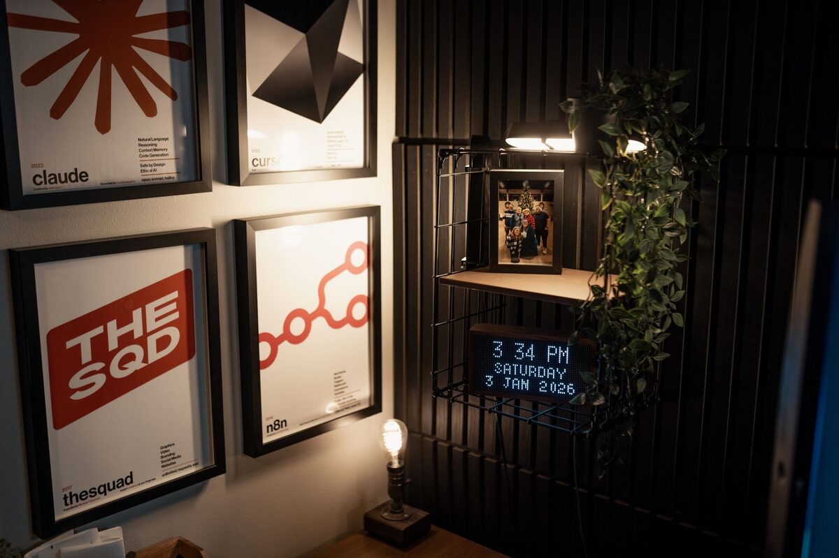 Dorm room wall decorated with posters and plants for a personalized minimalist aesthetic