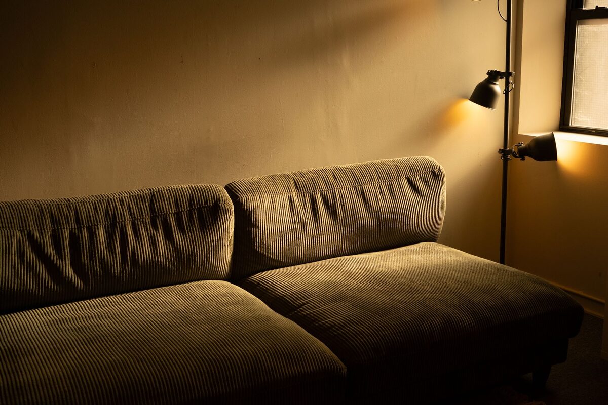 floor lamp casting warm glow in a cozy apartment