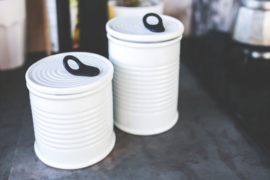 Modern ceramic kitchen canister set and accessories on a counter