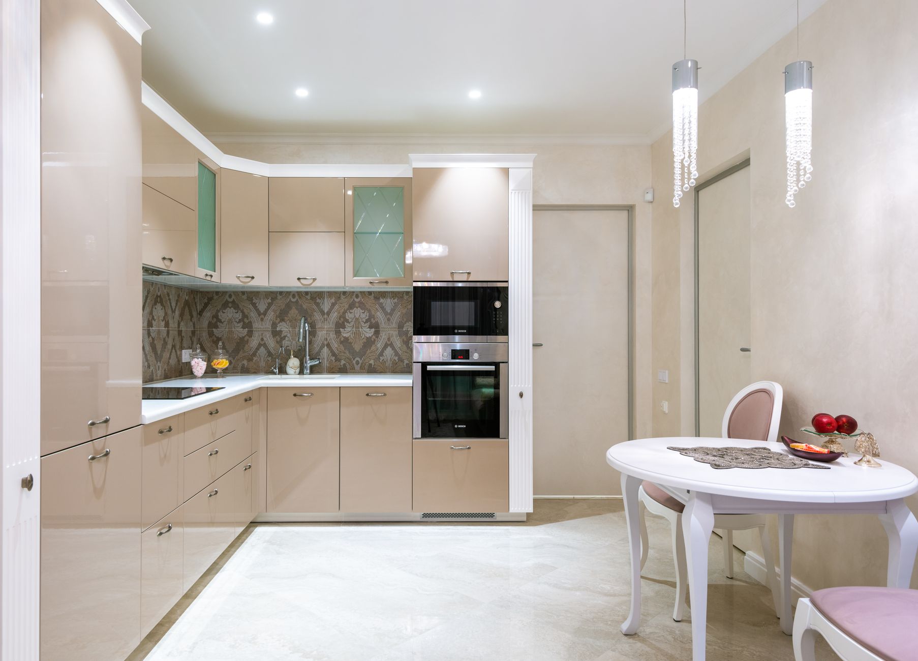 Small round dining table creating dedicated dining zone in apartment