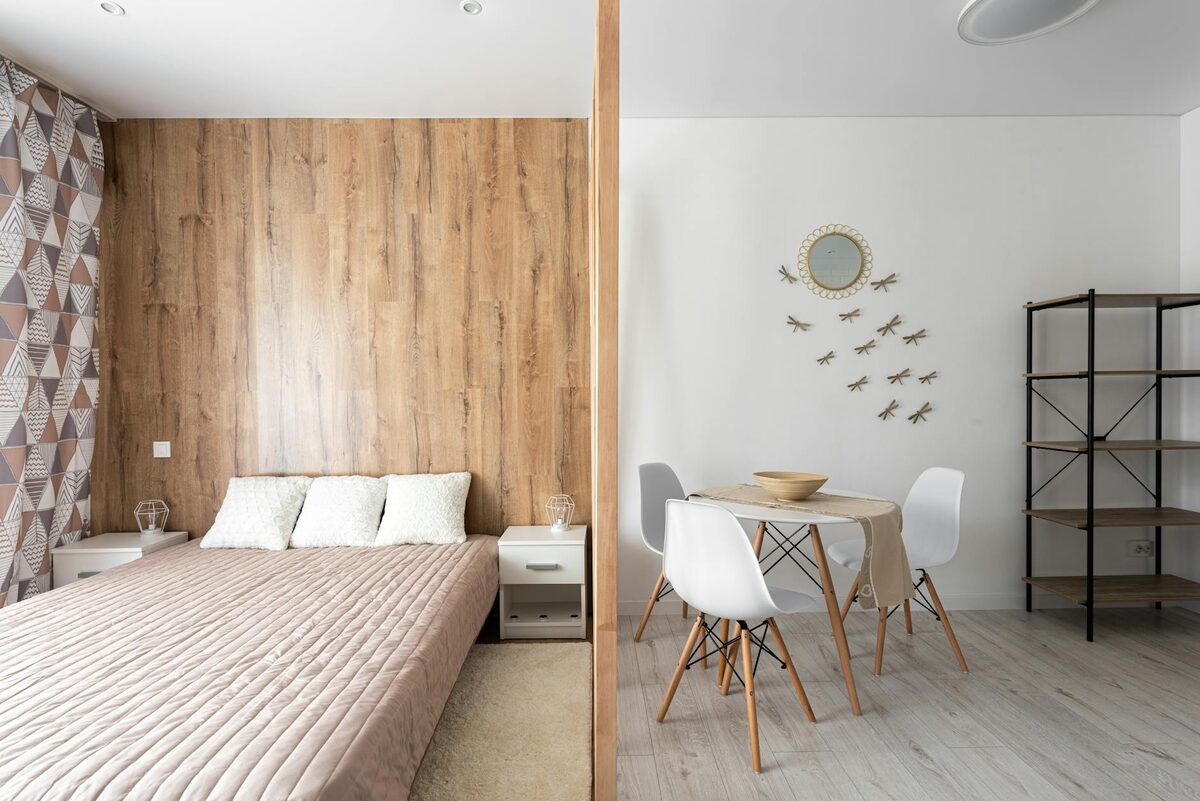 studio apartment decorating ideas on a budget — zoning with rugs and furniture